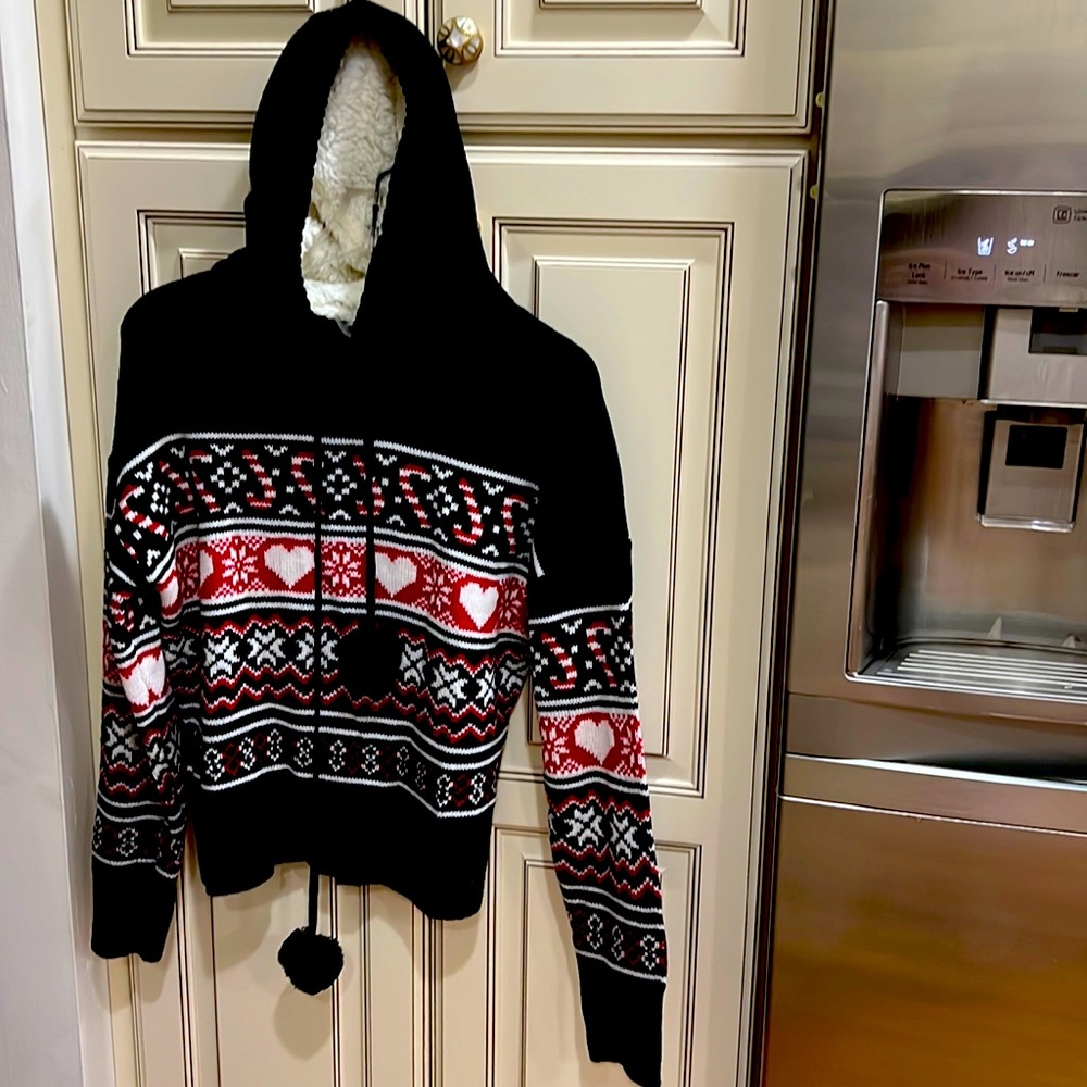 No Boundaries hooded fleece lined sweater in multi pattern black white and red